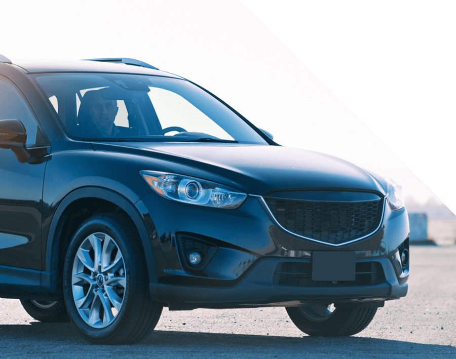Black SUV parked outdoors, showcasing a sleek design and polished exterior, representing Luxe Auto Salon's auto detailing services in Colorado Springs.