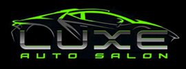 Luxe Auto Salon logo featuring a sleek car silhouette in green and gray, representing automotive services like vinyl wraps and paint protection.